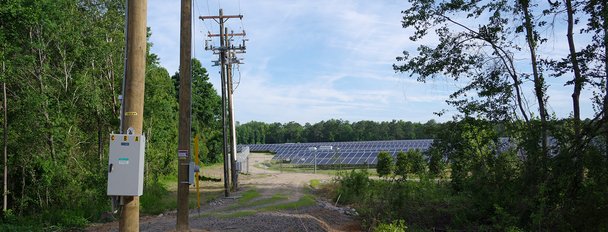 Power-Lines-And-Solar-Farm-In-Background.jpg