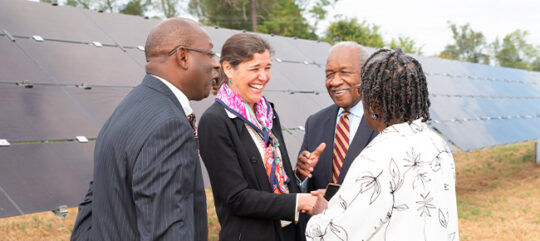 Sarah Slusser, CEO of Cypress Creek Renewables meets with Community members at a solar site opening