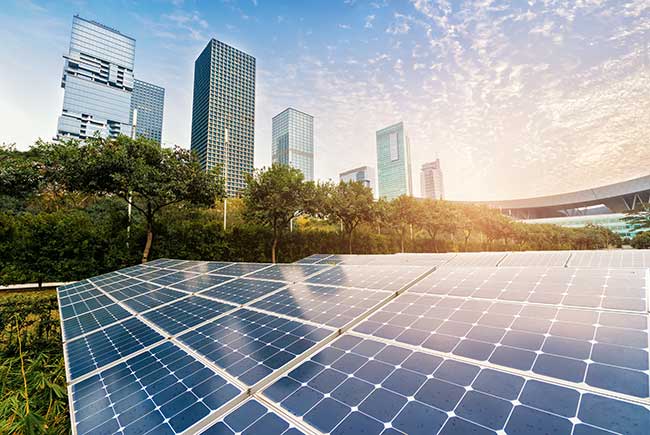 solar farm amidst an urban landscape with city skyscrapers in the backdrop