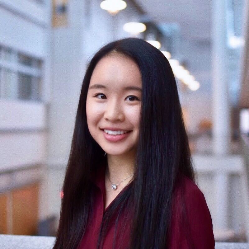 A photo of a smiling woman